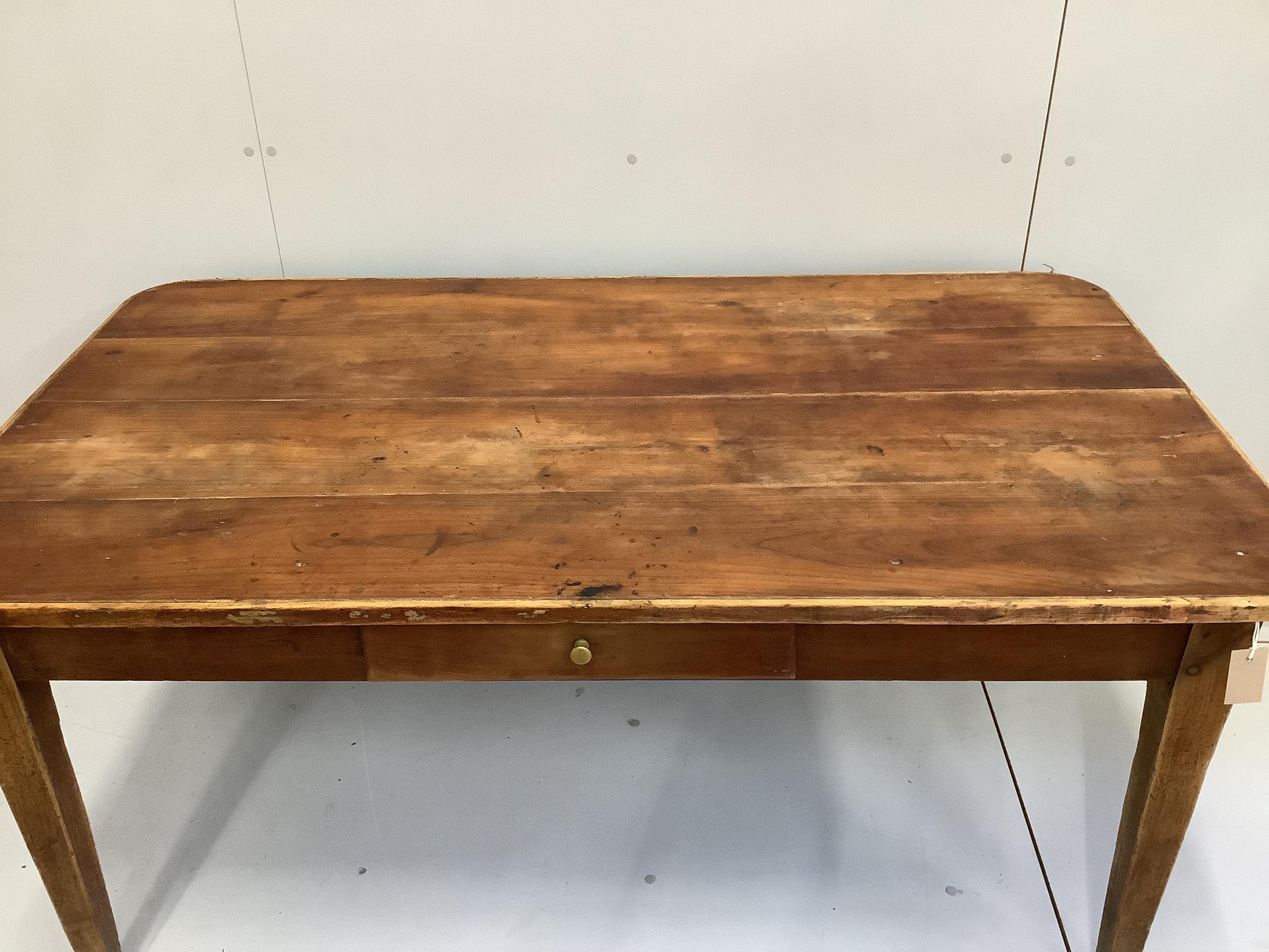 A 19th century French oak and fruitwood kitchen table, fitted drawer, length 149cm, width 83cm, height 72cm